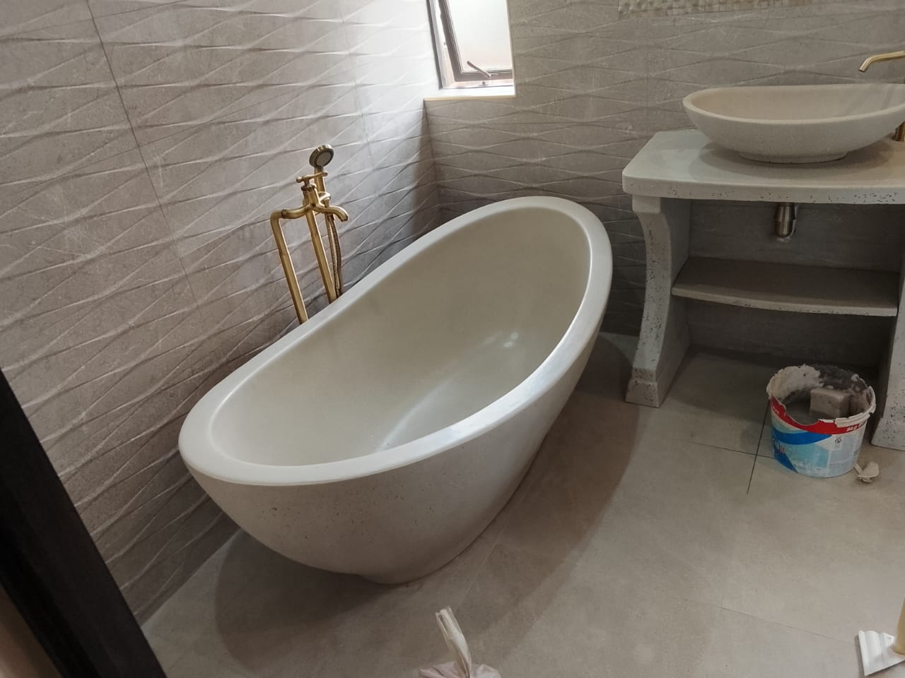Freestanding bathtub installed during a ZECO Construction bathroom renovation
