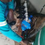 ZECO Construction pump technician servicing a water pump in Gauteng